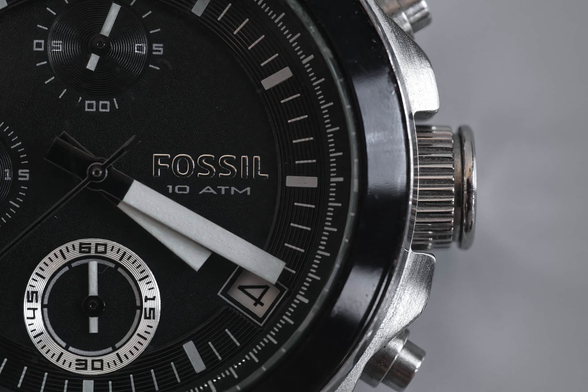 A close view of a classic watch dial on a calm neutral background